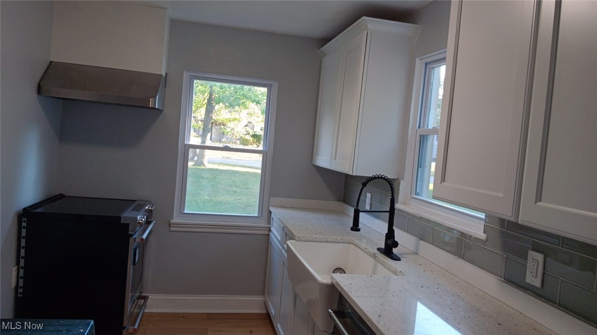 3999 Lancaster Road South Euclid, OH 44121 - Photo 15 of 17 Washroom with light hardwood / wood-style floors and sink