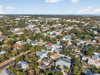 an aerial view of residential building with green space