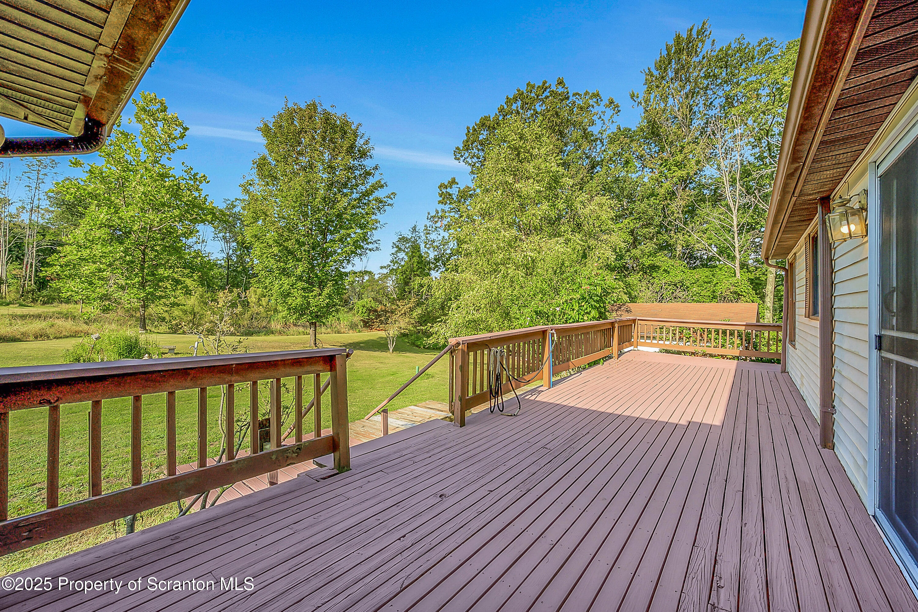 9119 Valley View Drive Clarks Summit, PA 18411 - Photo 67 of 78 a view of balcony with wooden floor and fence