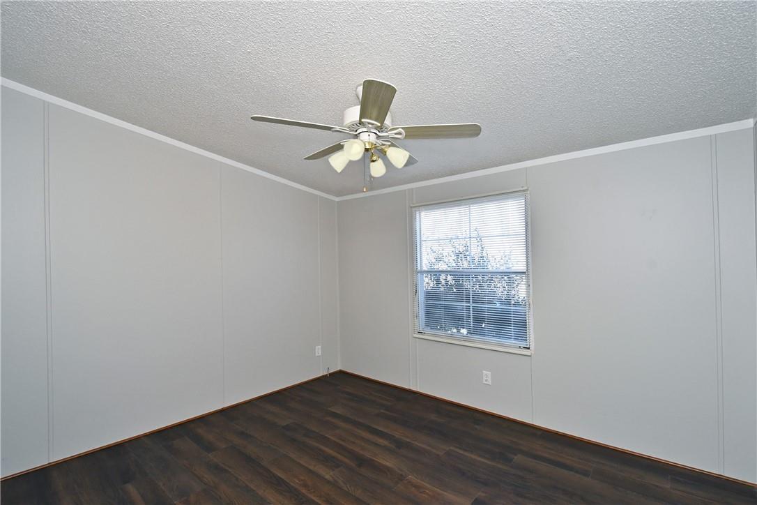 1524-l R L R Schronce Lane Iron Station, NC 28080 - Photo 12 of 32 a view of an empty room with a window and a fan