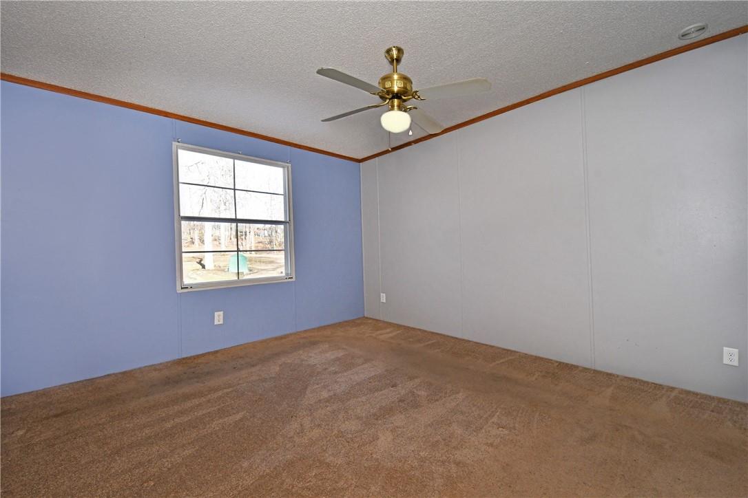 1524-l R L R Schronce Lane Iron Station, NC 28080 - Photo 17 of 32 an empty room with a window and a fan