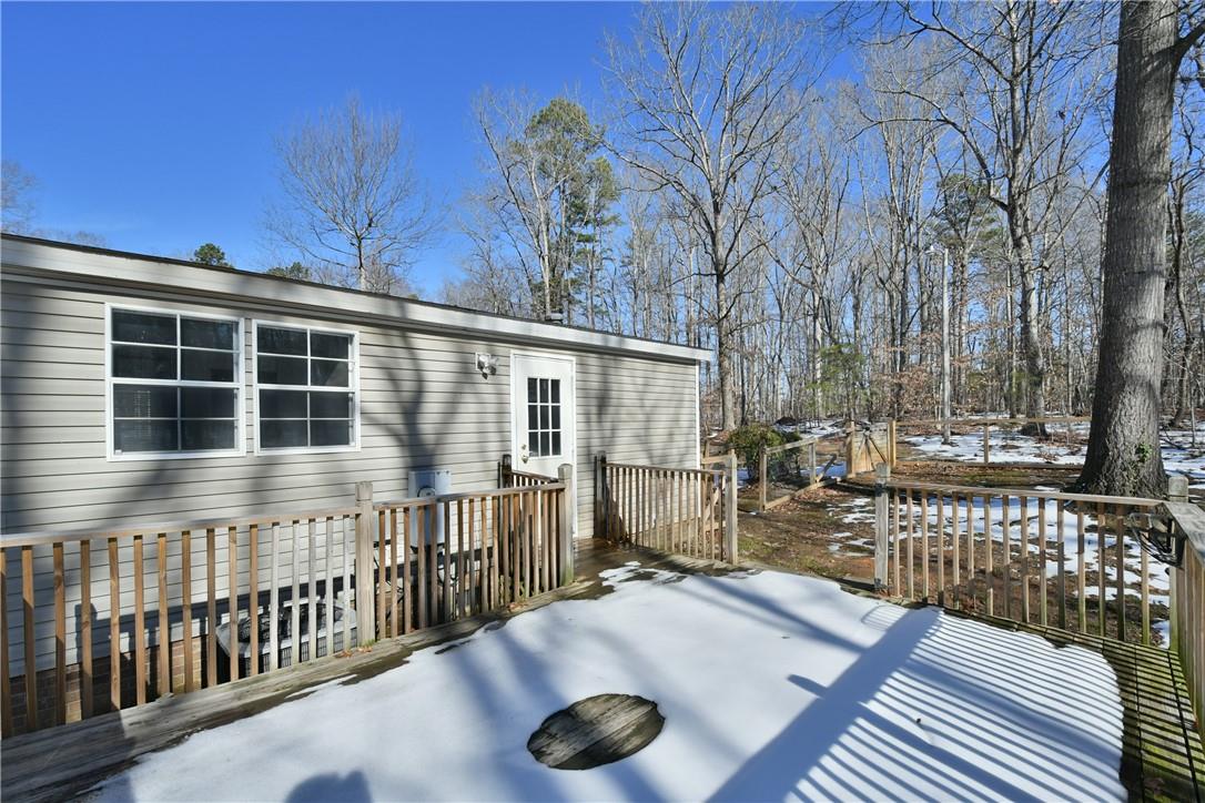 1524-l R L R Schronce Lane Iron Station, NC 28080 - Photo 26 of 32 a balcony with table and chairs and wooden fence