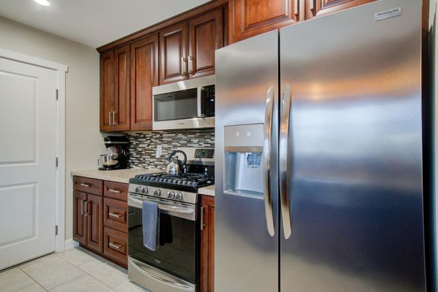 a bedroom with a bed and glass door