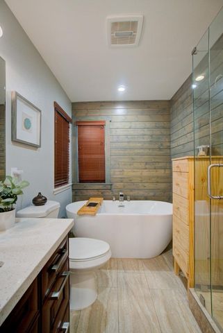 a white bath tub sitting in a bathroom