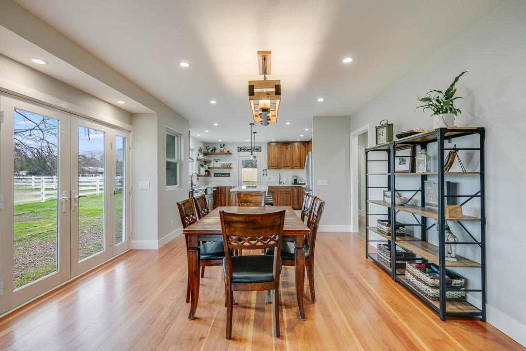 2015 Trumar Lane Gilroy, CA 95020 - Photo 11 of 30 a view of a dining room with furniture window and wooden floor