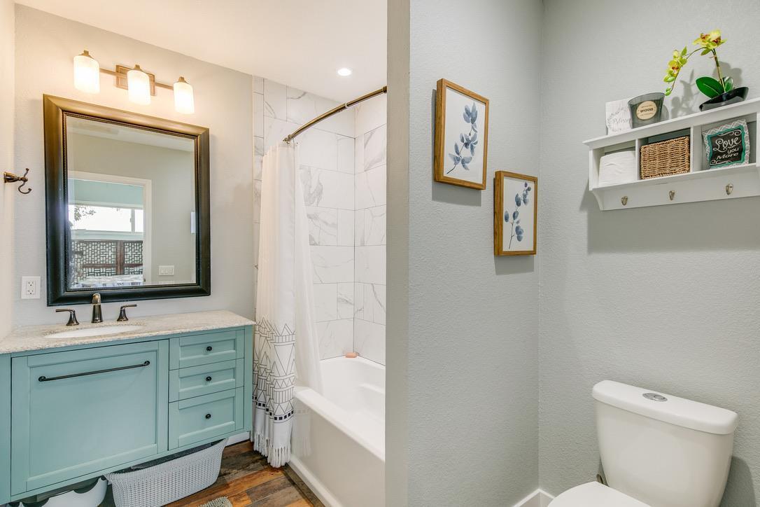 2015 Trumar Lane Gilroy, CA 95020 - Photo 15 of 30 a bathroom with a toilet sink and mirror