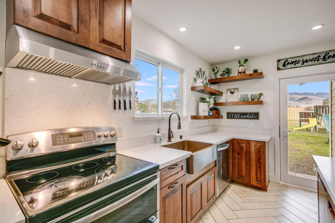 2015 Trumar Lane Gilroy, CA 95020 - Photo 8 of 30 a kitchen with a stove and a microwave