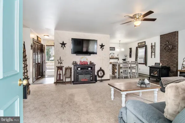 a view of living room with furniture and a flat screen tv