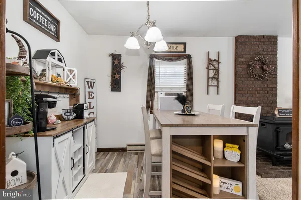 a view of living room kitchen and entryway