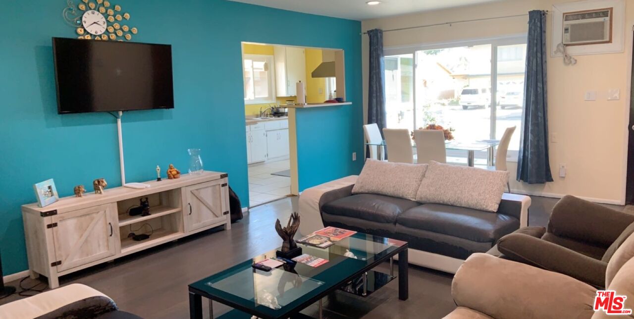 Undisclosed Address Norwalk, CA 90650 - Photo 18 of 19 a living room with furniture and a flat screen tv