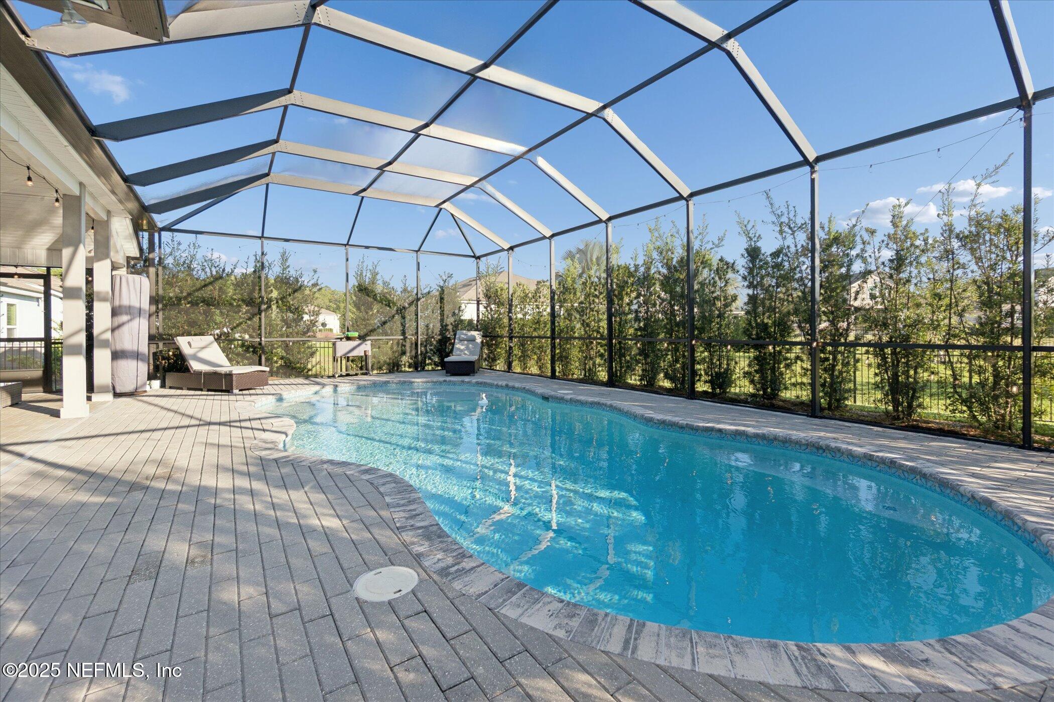 49 Sunberry Way St. Augustine, FL 32092 - Photo 24 of 30 a view of a backyard with sitting area