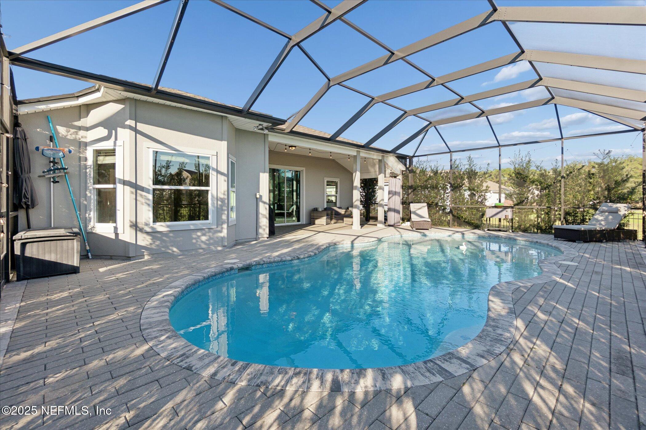 49 Sunberry Way St. Augustine, FL 32092 - Photo 25 of 30 a view of a swimming pool with a patio