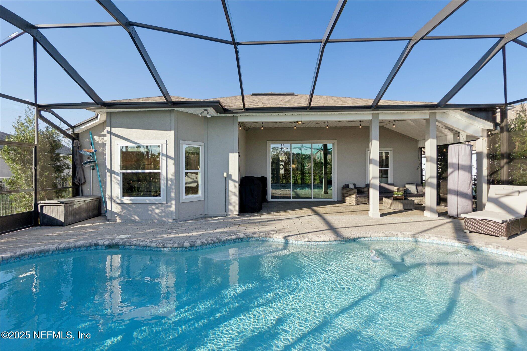 49 Sunberry Way St. Augustine, FL 32092 - Photo 26 of 30 a swimming pool with outdoor seating