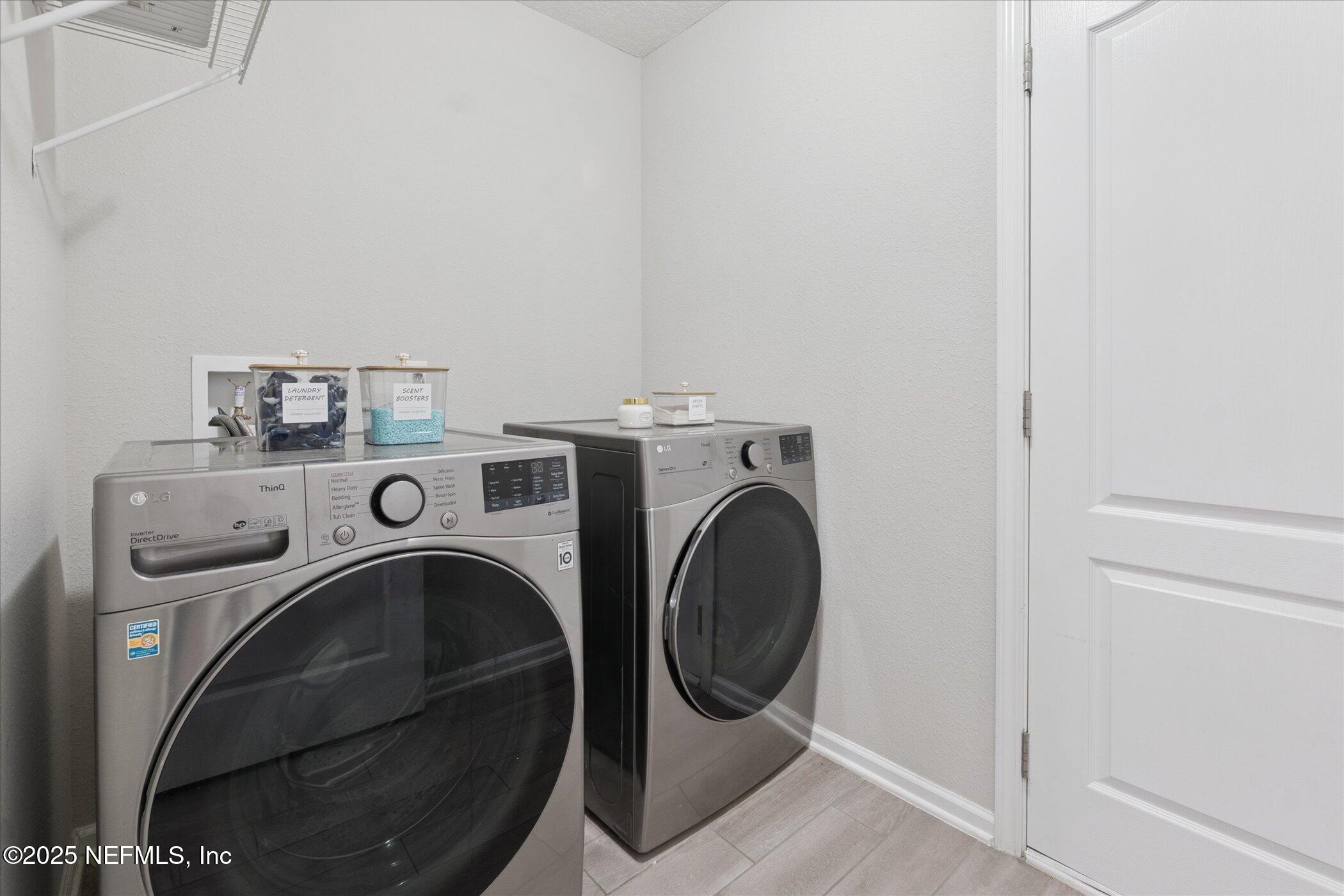 49 Sunberry Way St. Augustine, FL 32092 - Photo 27 of 30 a utility room with dryer and washer