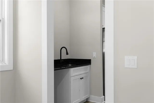 a kitchen with stainless steel appliances granite countertop a stove top oven a sink and dishwasher