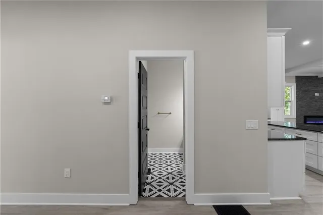 a kitchen with stainless steel appliances a sink stove and cabinets