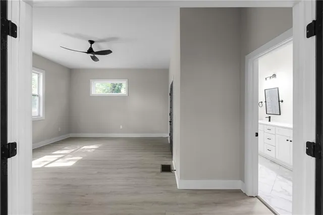 a view of an empty room with a window