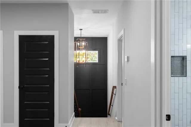 a bathroom with a glass shower door