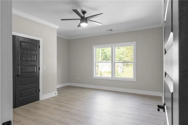 a spacious bathroom with a bathtub and shower