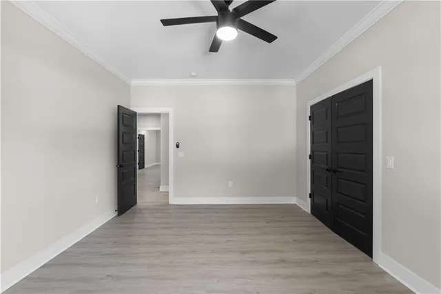 a white bath tub sitting in a bathroom next to a window