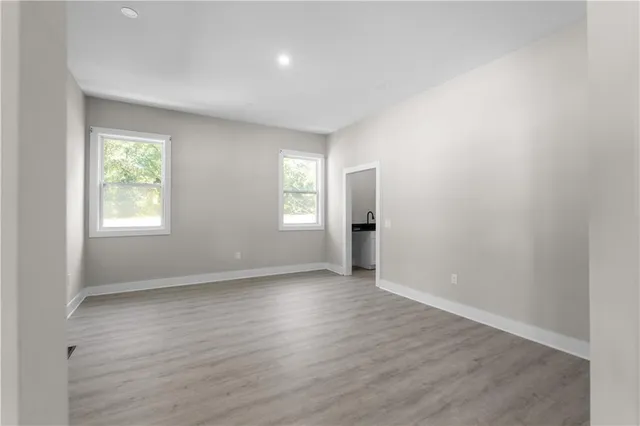 a large kitchen with stainless steel appliances granite countertop a large counter top and a stove