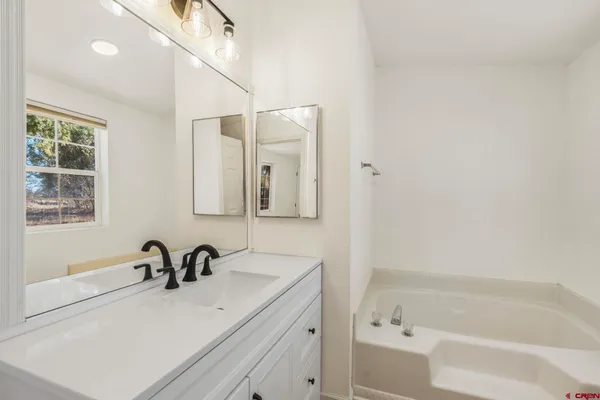 a bathroom with a sink and a bathtub
