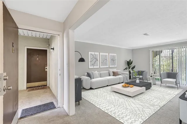 a living room with furniture and a table