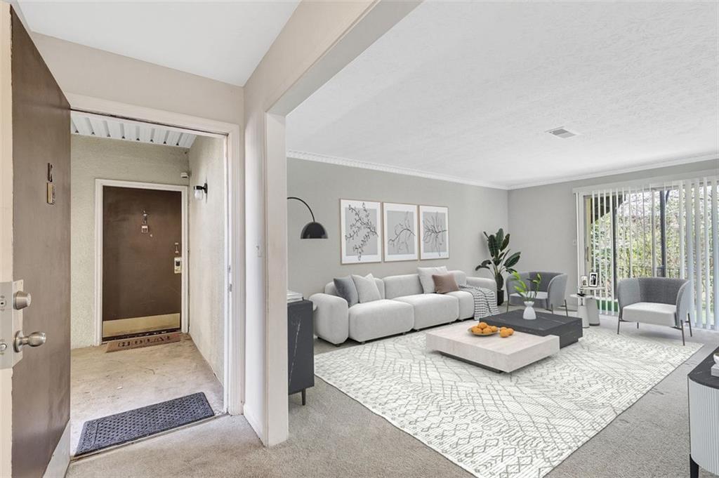 a living room with furniture and a table