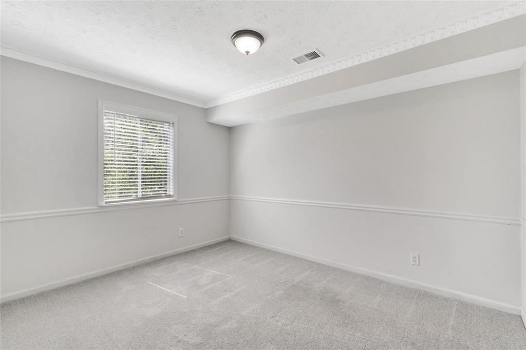 2390 Lawrenceville Highway, Unit K Decatur, GA 30033 - Photo 20 of 22 a view of an empty room with a window