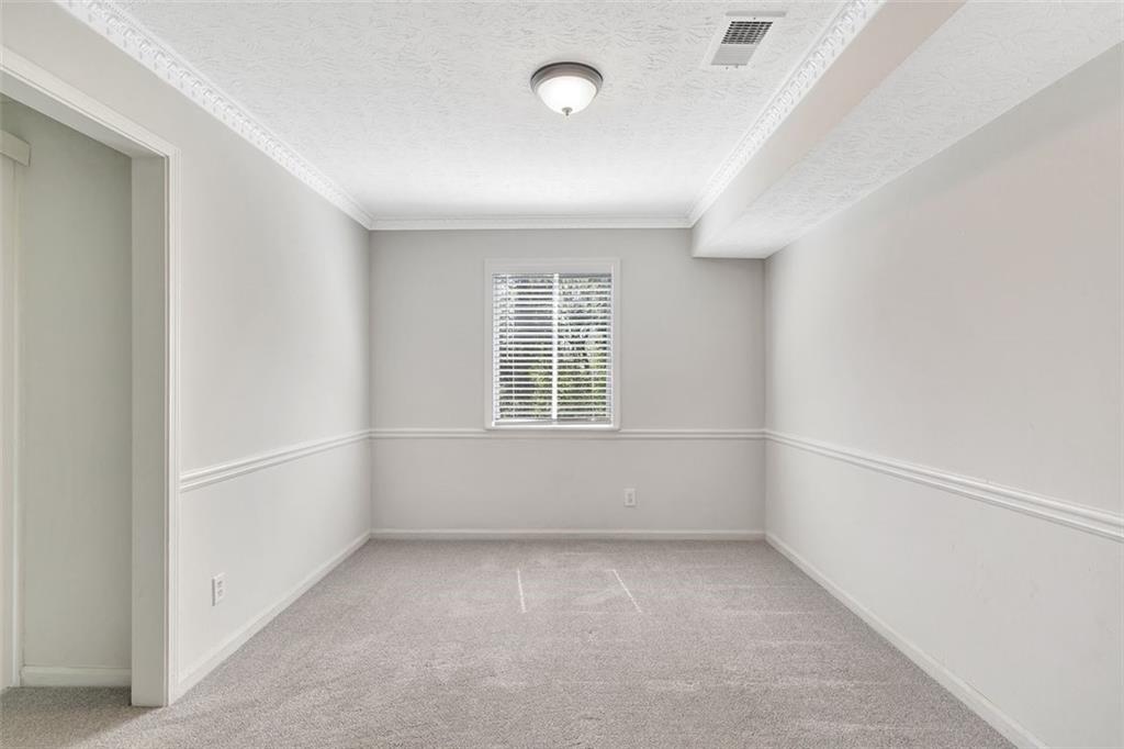2390 Lawrenceville Highway, Unit K Decatur, GA 30033 - Photo 21 of 22 an empty room with windows