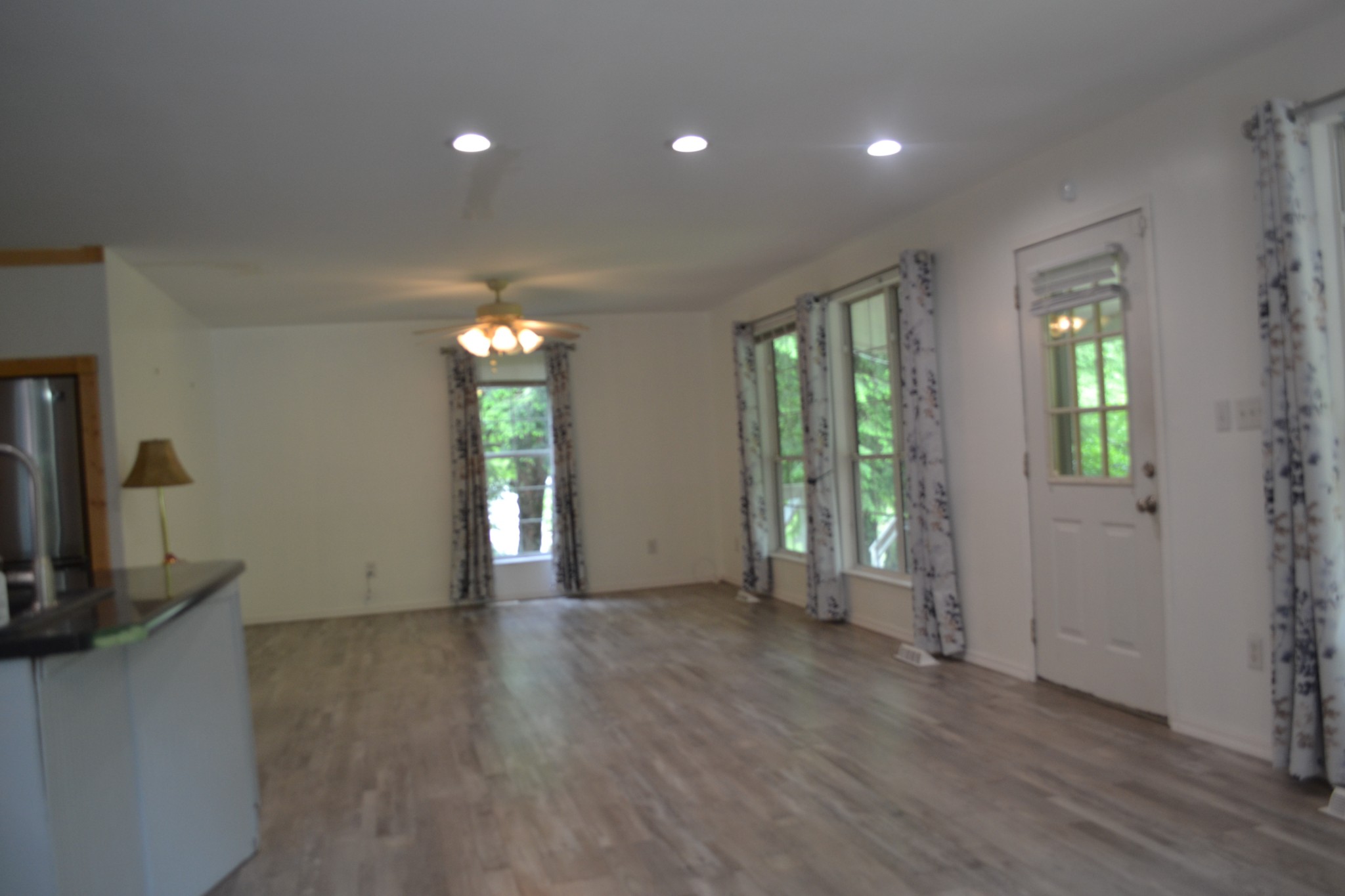 1505 Add Stafford Road Hilham, TN 38568 - Photo 3 of 65 a view of an empty room with wooden floor and a window
