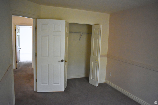 3327 East Windhover Road Eagle Mountain, UT 84005 - Photo 20 of 38 Room with neutral-toned walls, gray carpet flooring, and white baseboards