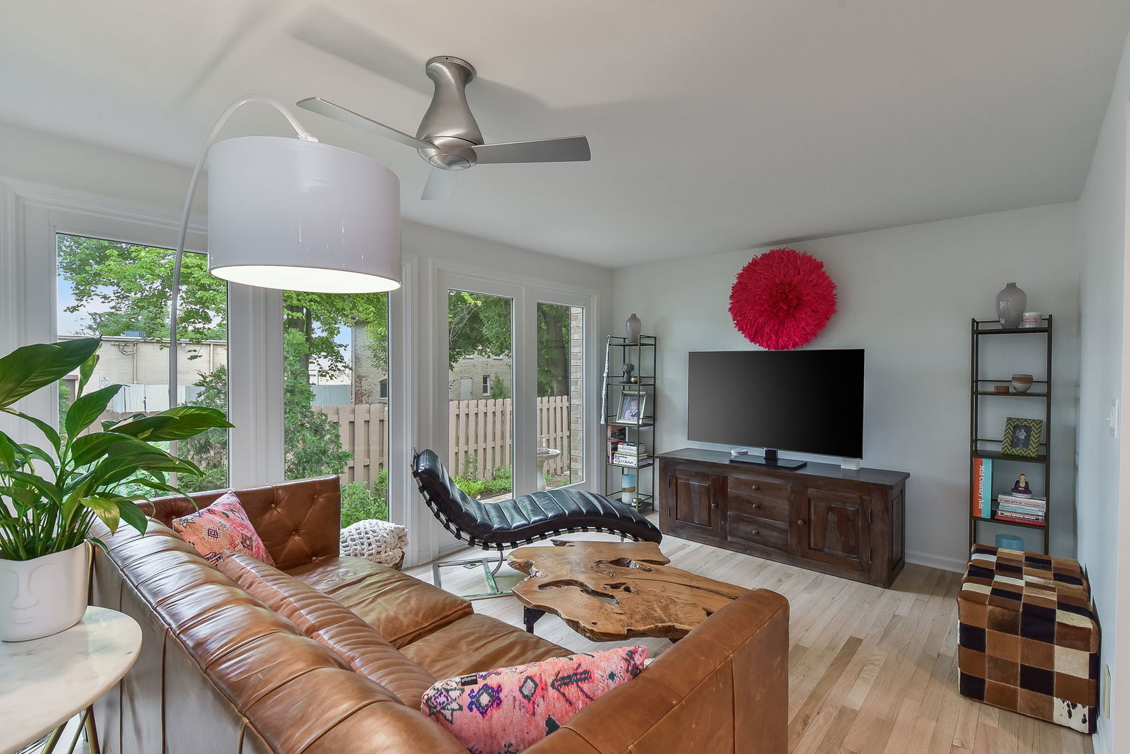 704 Natwill Square Geneva, IL 60134 - Photo 11 of 35 a living room with furniture a flat screen tv and a fireplace
