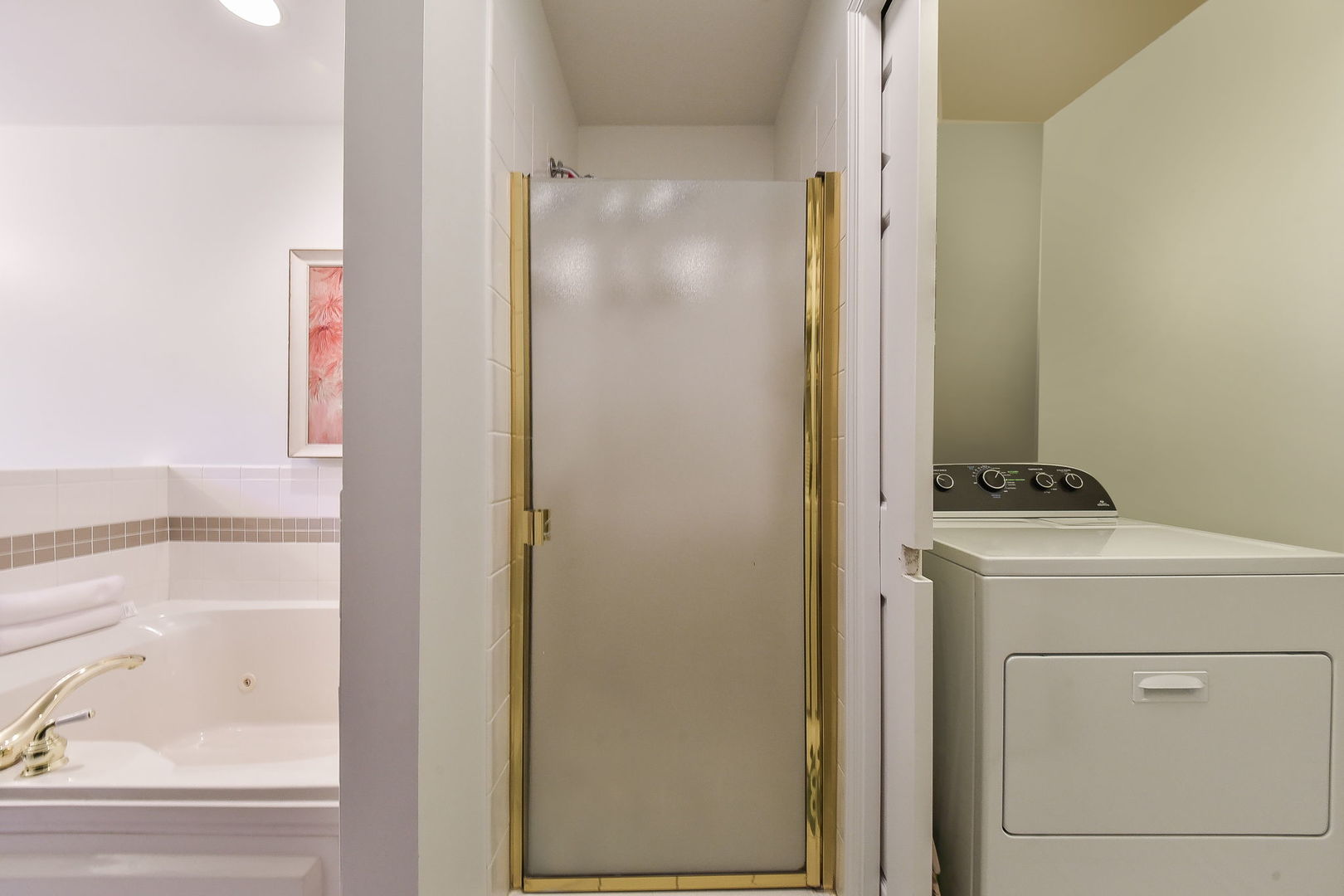 704 Natwill Square Geneva, IL 60134 - Photo 17 of 35 a bathroom with a shower and a sink