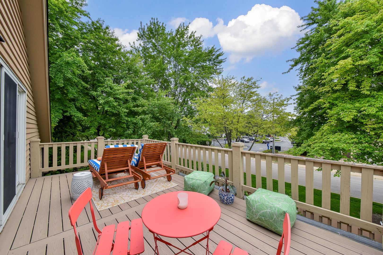 704 Natwill Square Geneva, IL 60134 - Photo 20 of 35 a balcony with wooden floor table and chairs
