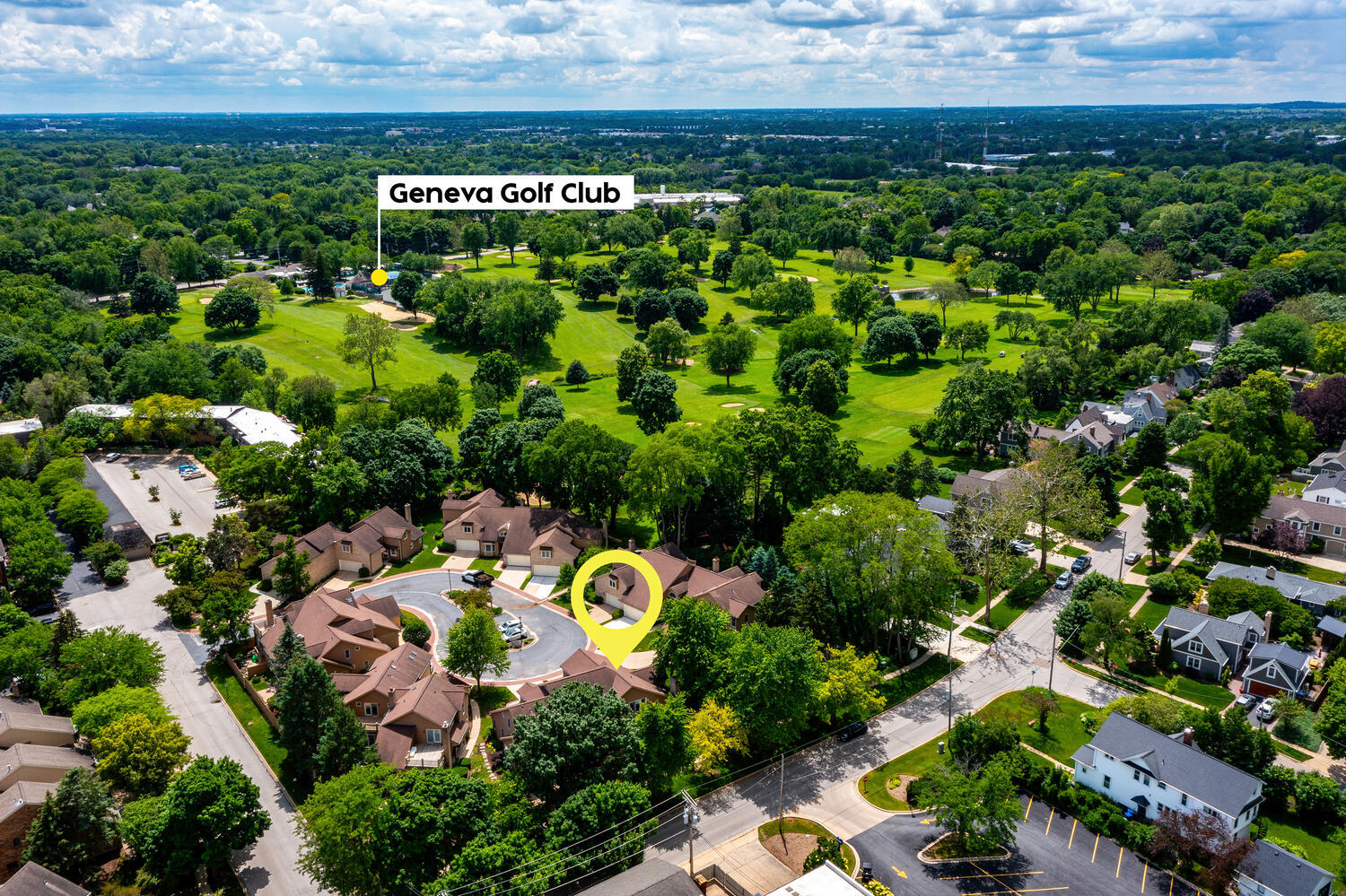 704 Natwill Square Geneva, IL 60134 - Photo 34 of 35 an aerial view of a house with a yard and swimming pool