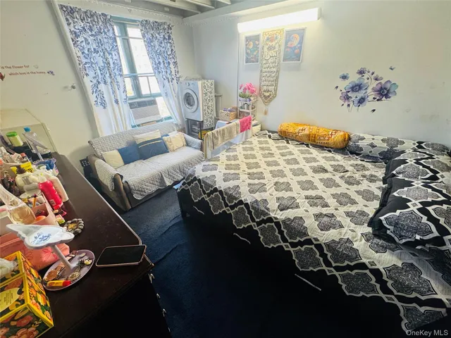 a bed room with a bed and a chandelier