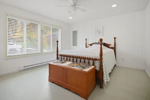 a bed room with a bed and a window