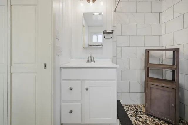 a bathroom with a sink and a mirror