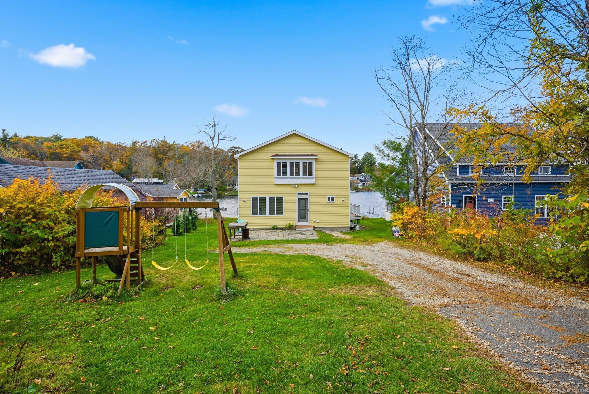136 Sandy Beach Road Goshen, CT 06756 - Photo 22 of 26 a view of a house with a yard and sitting area