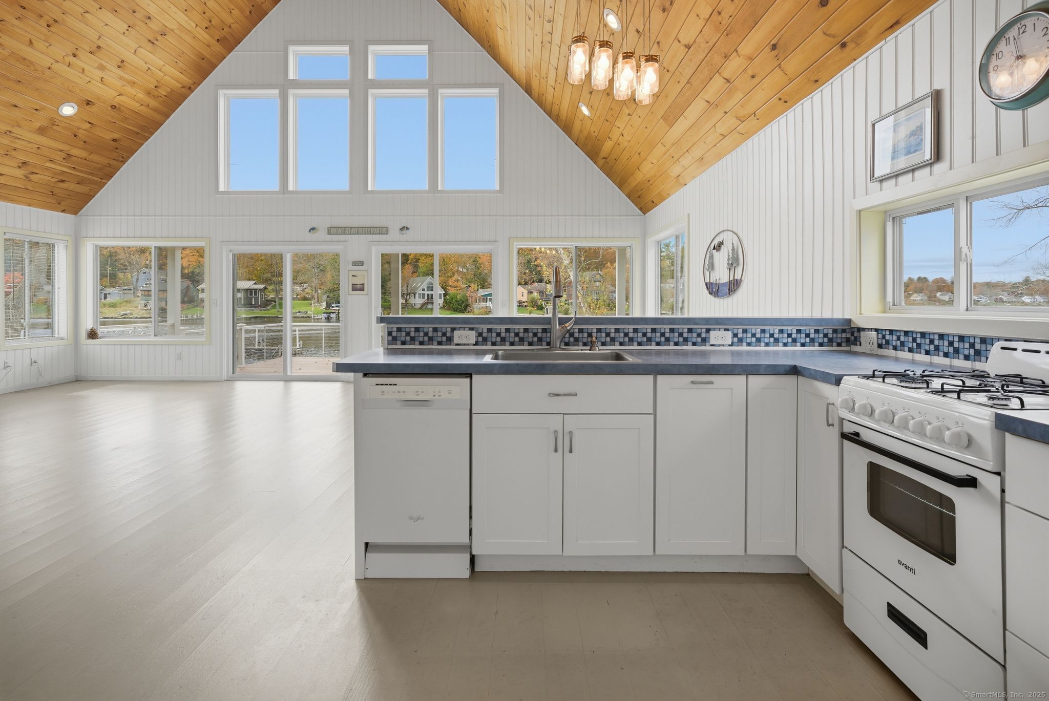 136 Sandy Beach Road Goshen, CT 06756 - Photo 5 of 26 a kitchen with stainless steel appliances granite countertop a stove and a sink