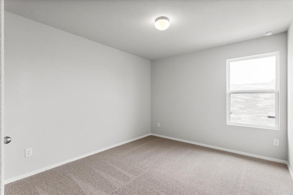 2707 Totley Road Manor, TX 78653 - Photo 30 of 39 Unfurnished room featuring carpet floors and baseboards