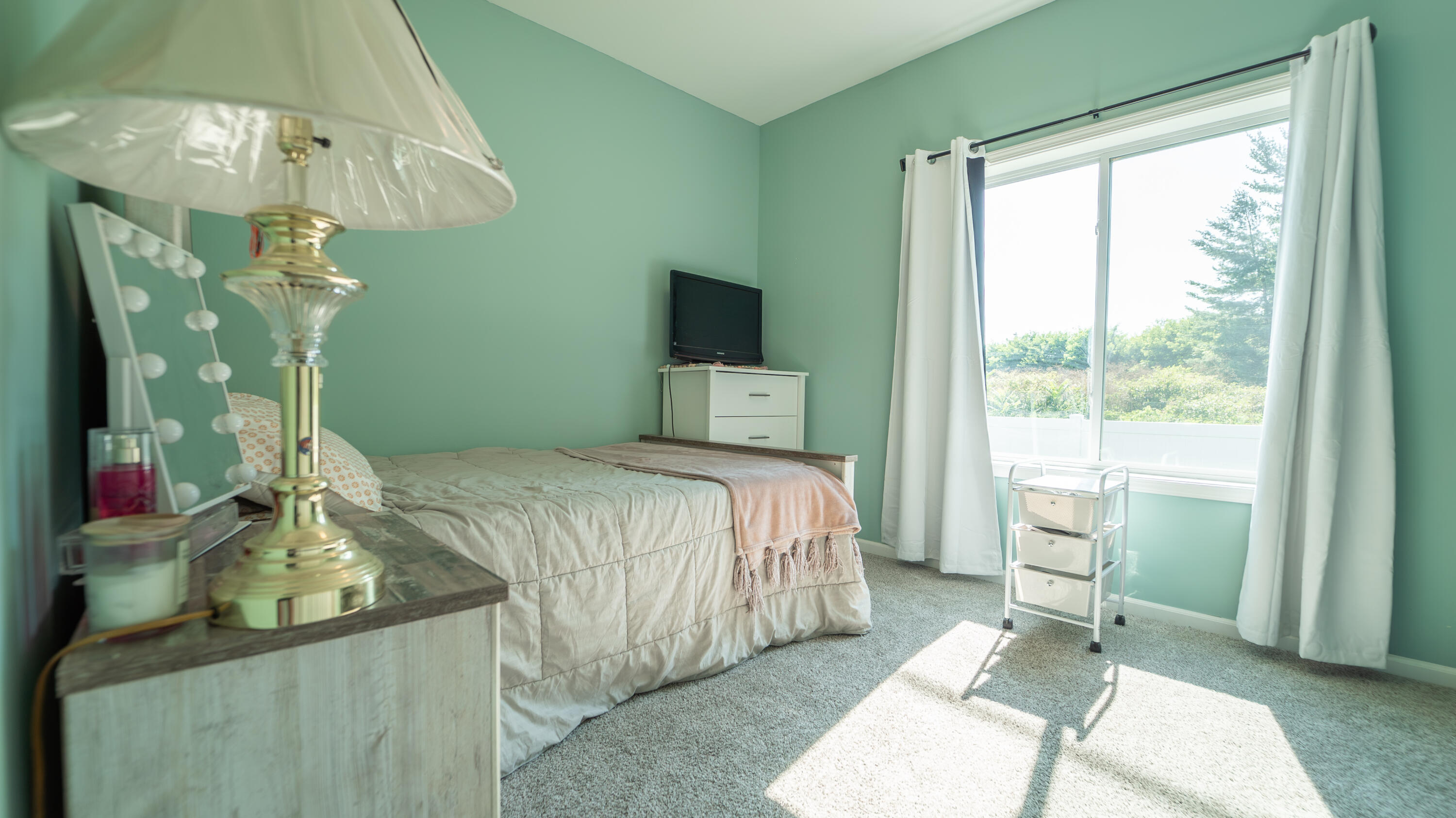 538 Emerald Drive Chesterton, IN 46304 - Photo 17 of 25 a bedroom with a bed and a mirror