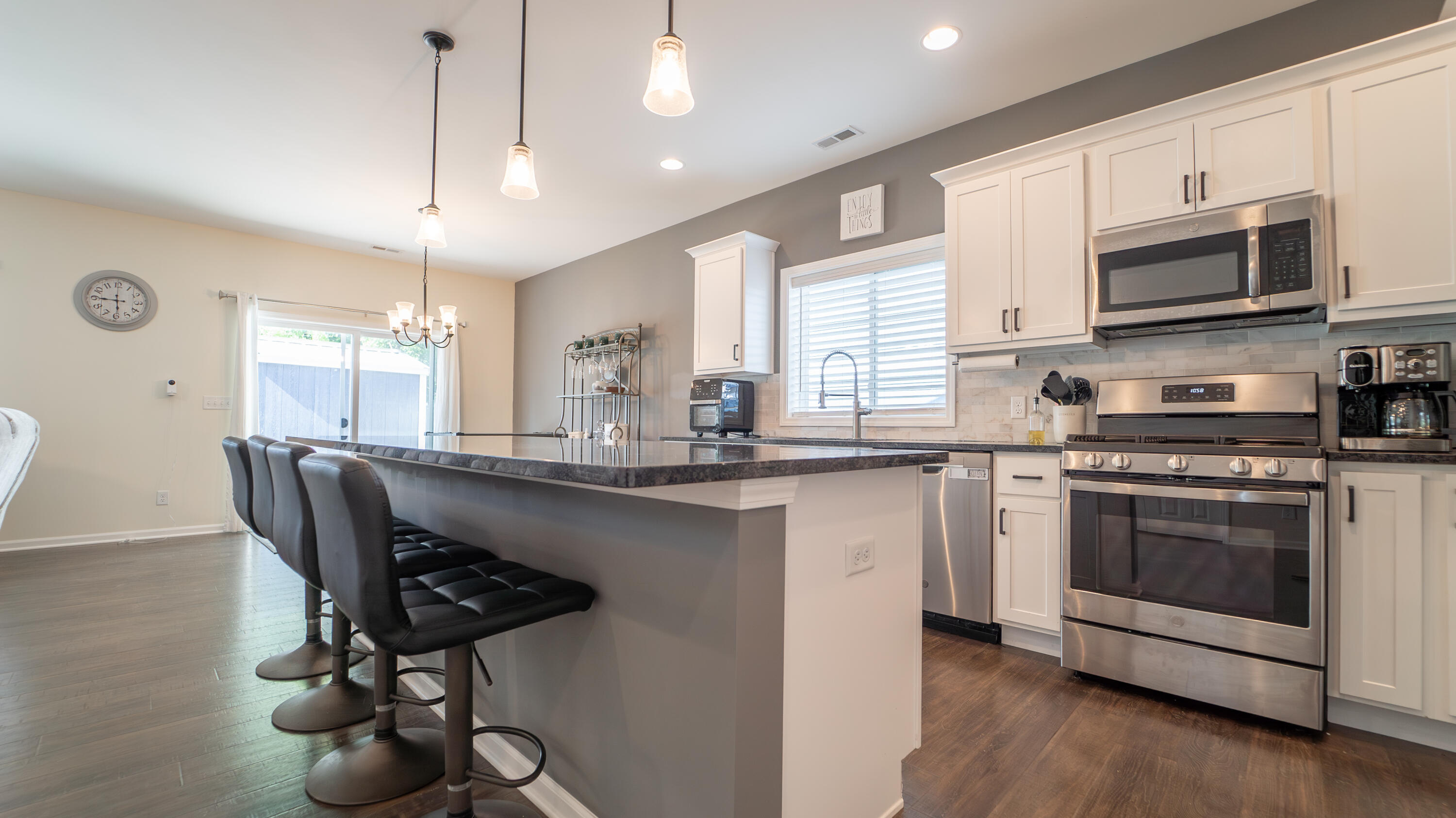 538 Emerald Drive Chesterton, IN 46304 - Photo 4 of 25 a kitchen with stainless steel appliances a microwave a stove a sink dishwasher a microwave oven with cabinets and wooden floor