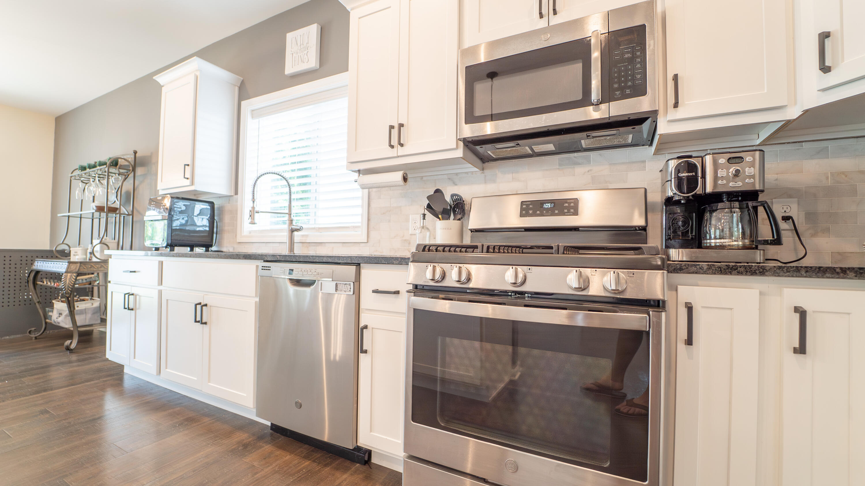 538 Emerald Drive Chesterton, IN 46304 - Photo 6 of 25 a kitchen with stainless steel appliances granite countertop a stove microwave and cabinets