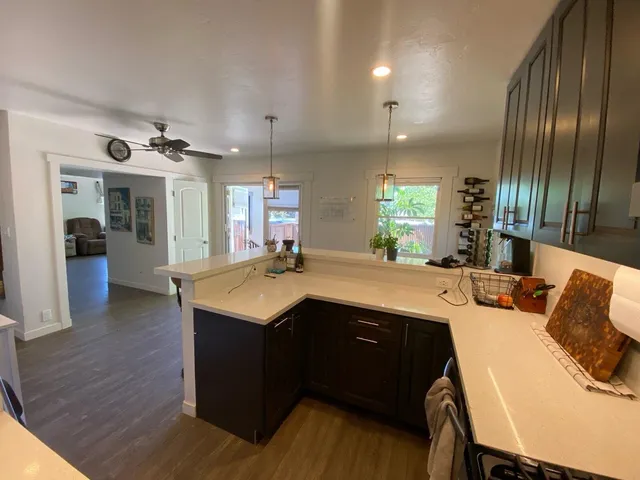 a kitchen with a sink and cabinets