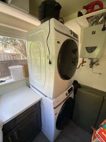 a utility room with dryer and washer