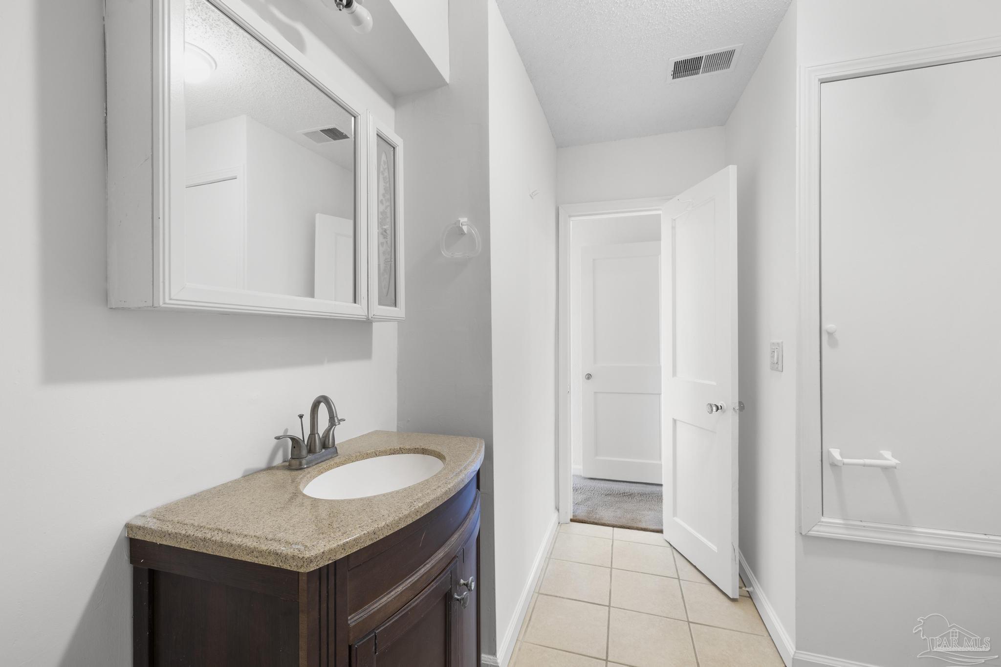 208 Berry Road Pensacola, FL 32507 - Photo 29 of 41 a bathroom with a sink and a mirror