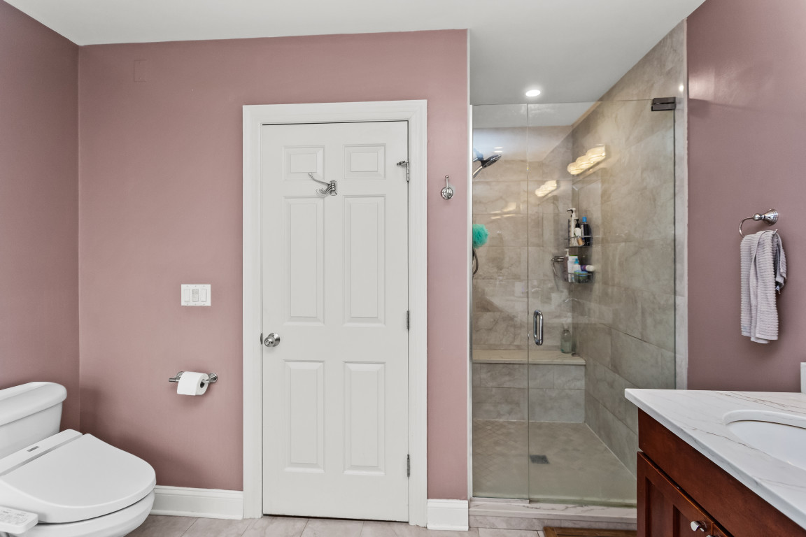 4635 North Malden Street, Unit 3S Chicago, IL 60640 - Photo 16 of 20 a bathroom with a granite countertop sink a toilet and shower