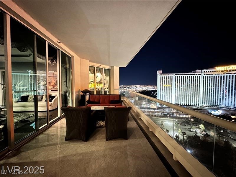 2857 Paradise Road, Unit 2103 Las Vegas, NV 89109 - Photo 39 of 55 Balcony at night featuring a view of city lights